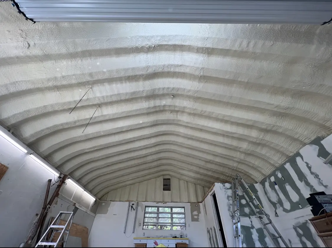 Spray polyurethane foam applied to the underside of a metal roof deck in Bethel
